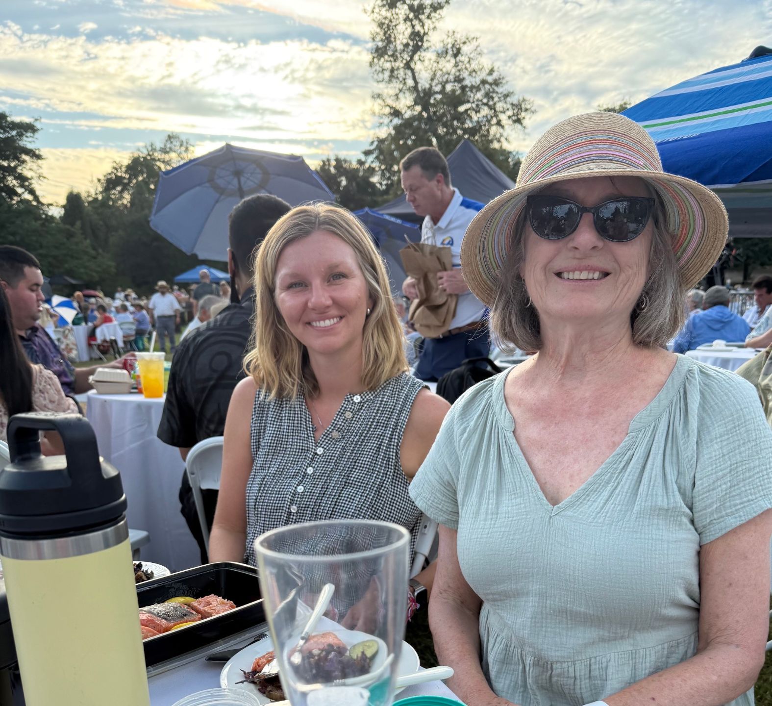 two women at an outdoor concert