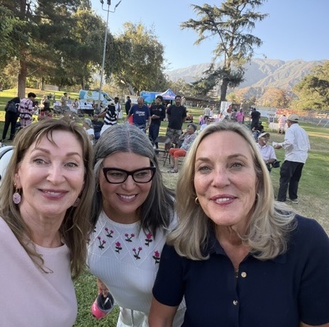 three woman taking a selfie outdoors