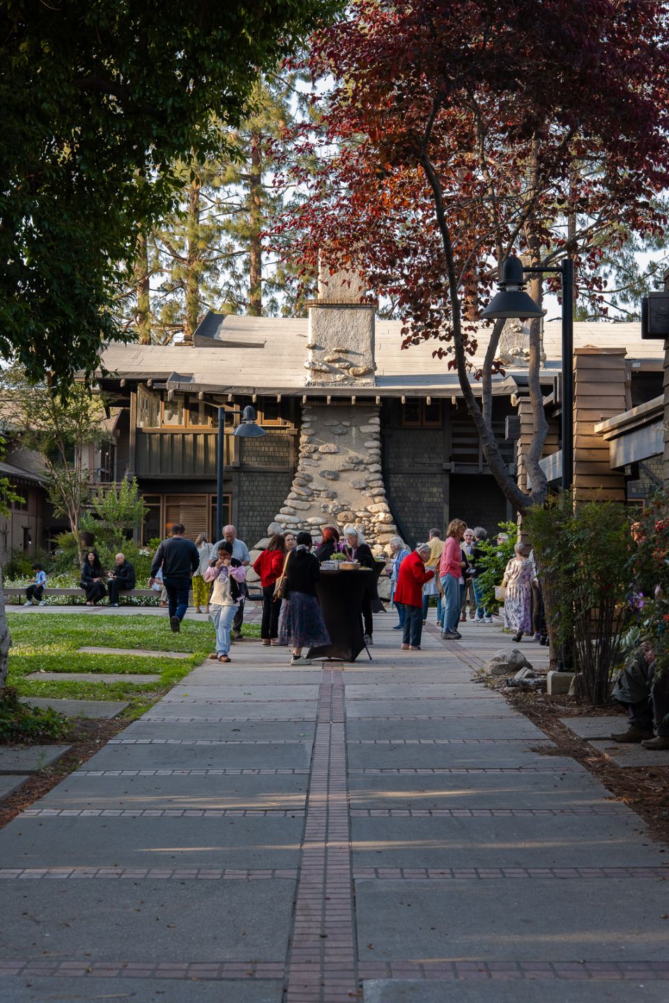 a group of people outside a stone building